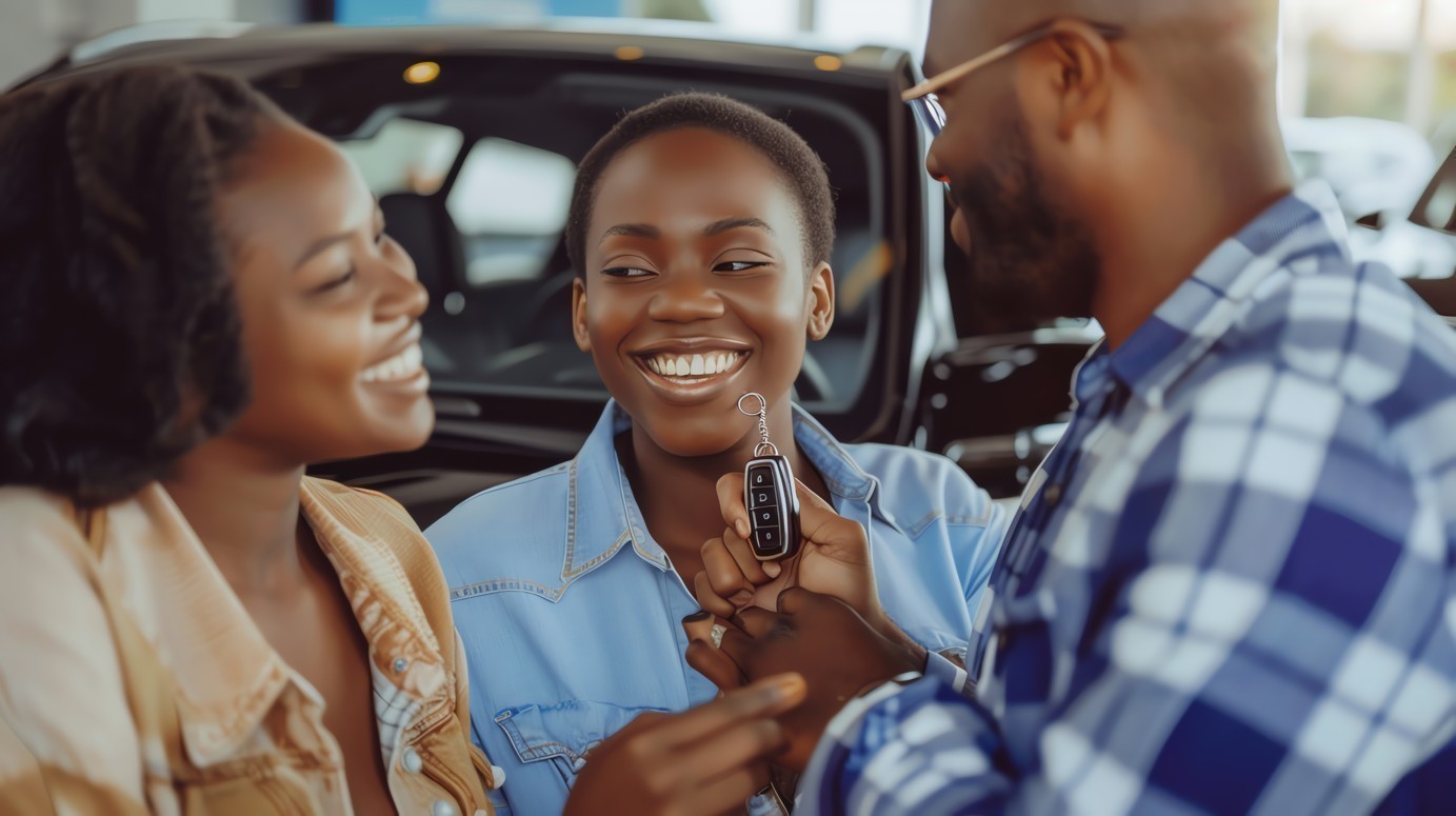 carrousel/three-people-are-smiling-holding-car-keys-car-dealership_1.jpg